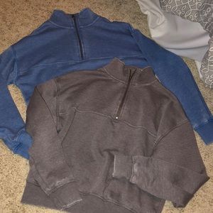 2 half zip sweaters